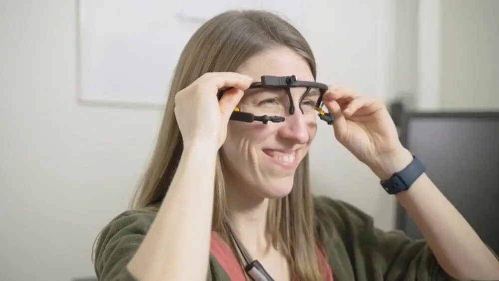 Person putting on eye tracking glasses